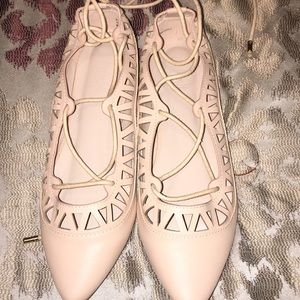 Nice clean pink flat shoes for a party.